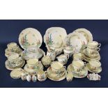 A quantity of Crown Staffordshire art deco tea wares with polychrome painted garden decoration