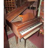 A Graham Foster iron framed baby grand piano, with polished mahogany case, raised on three square