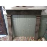 A Coalbrookdale cast iron fire surround/chimney piece with stop fluting and flower head detail,