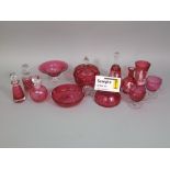 An extensive collection of 19th century and later cranberry glass to include Mary Gregory type