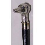 Ebonised walking stick with cast white metal dog head finial