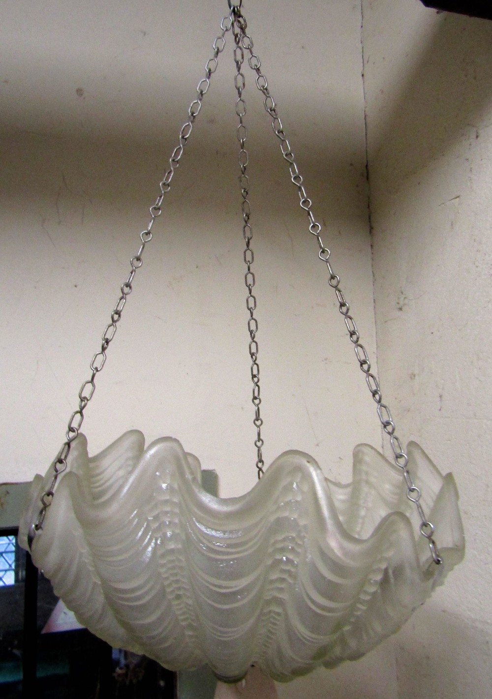 An Art Deco period hanging ceiling light in the form of a scallop shell