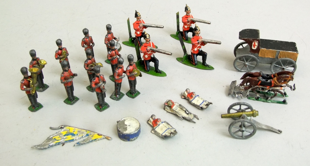 Eleven piece military band, four crouching riflemen, first aid wagon, etc