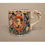 A Burleigh ware George VI coronation mug designed by Dame Laura Knight, 8 cm high approx