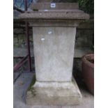 A weathered cast composition stone three sectional garden planter with stepped top, square section