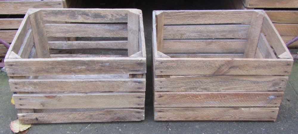 Fourteen rustic wooden crates of rectangular open slatted form, 50 cm long x 40 cm wide x 32 cm