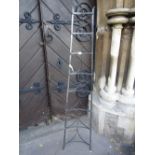 A vintage steel floorstanding eight tier graduated saucepan stand, 170 cm high approx