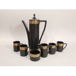 A collection of Portmeirion black ground coffee wares with gilt Greek key detail comprising coffee