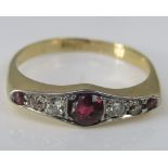 An 18ct art deco style ruby and diamond ring, size M/N, 2.8g