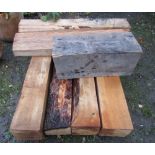 Six smaller mill cut soft wood blocks approx 132 cm long x 20 cm square approx, together with one