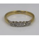 A five stone diamond ring in 18ct gold and platinum, size Q, 3.4g