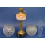 19th century brass oil lamp with Corinthian column stem and opaline glass reservoir, together with