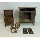 A collection of miniature Breton style furniture comprising a dresser, the base enclosed by two