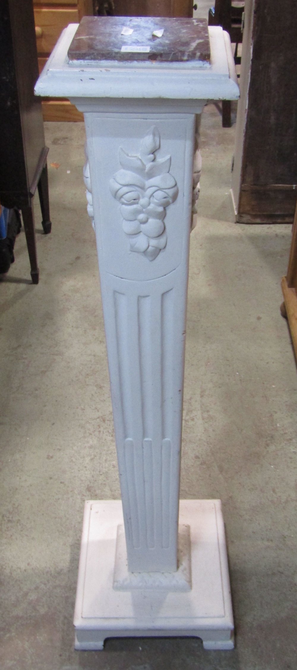 A painted Georgian style torchere, the square tapered column with fluted and applied floral detail