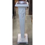 A painted Georgian style torchere, the square tapered column with fluted and applied floral detail