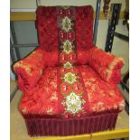 A mid-Victorian upholstered drawing room chair, the crimson and gold fabric with button back arms