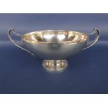 Early 20th century arts and crafts silver twin handled pedestal bowl, with leaf decoration and