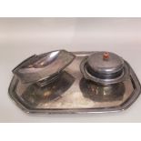 Three pieces of art deco silver plate, to include a large octagonal tray, a lidded muffin dish and a