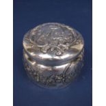 Continental '800' silver box and cover, embossed with cherubs monuments and scrolled foliage,