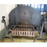 A cast iron fire basket of rectangular form and loose andirons with double scrolled finials, the