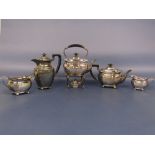 1920s silver five piece tea service of faceted baluster form comprising tea pot, water pot, milk