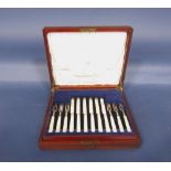 Mahogany cased canteen fitted with two tiers of pearl handled silver flatware to include twelve