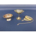 Eastern silver pedestal bonbon dish with wavy rim and embossed decoration; together with a further