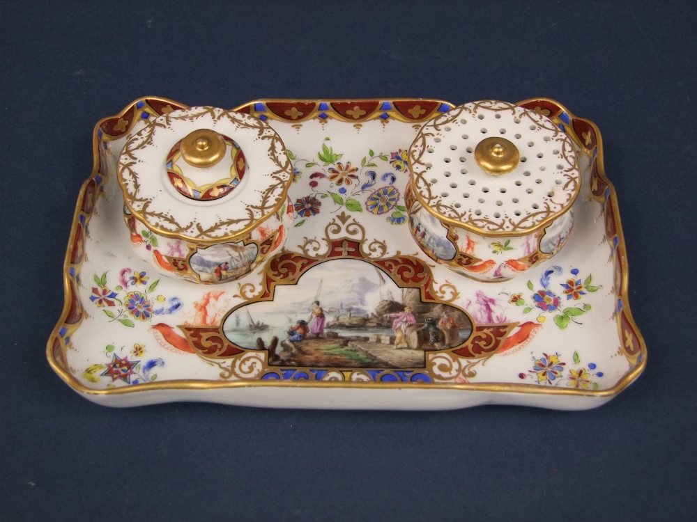 A 19th century continental Meissen type standish with reserved painted panels of harbour scenes,