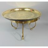 Good art nouveau polished brass table/stand, with scrolled base and twin hoop handles, 44cm