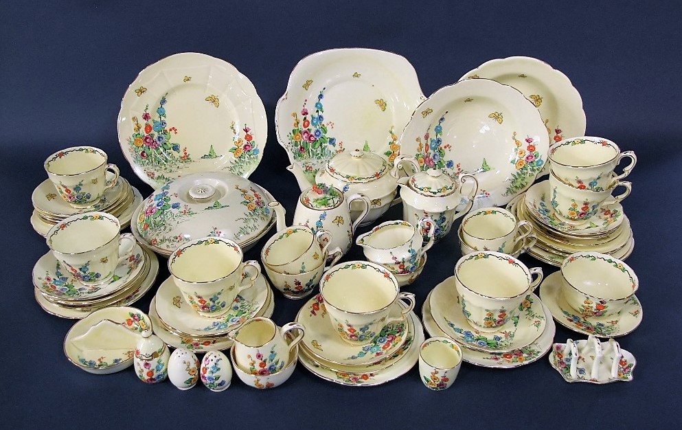 A quantity of Crown Staffordshire art deco tea wares with polychrome painted garden decoration