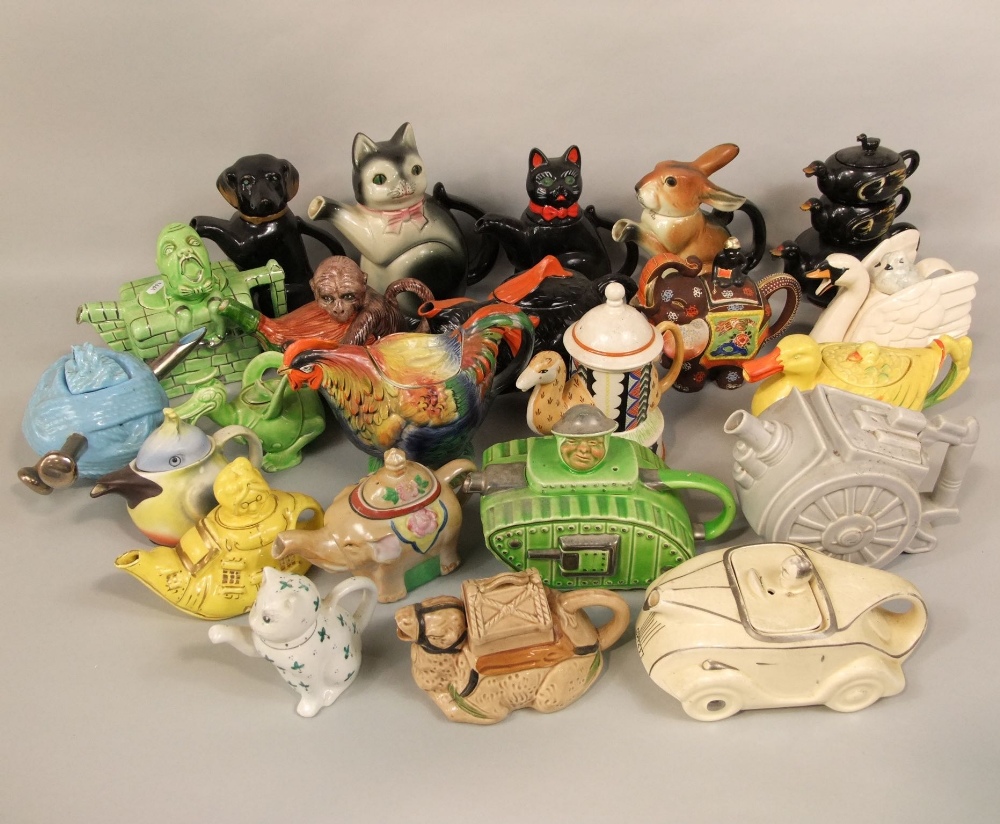 A quantity of various novelty tea pots including animals and birds, an example modelled as a canon