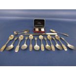 A small quantity of silver flatware to include a collection of fiddle pattern spoons, sugar nips and