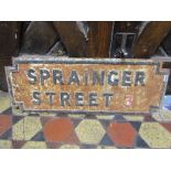 A reclaimed cast iron street sign of rectangular form with stepped corners and raised lettering