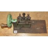 A vintage Yale bench top cast iron hand operated key cutting machine/lathe stamped Yale, the Yale