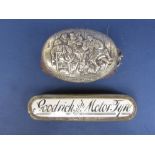 Continental white metal dressing brush, the top embossed with an interior tavern scene with figures,