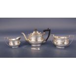 Late Victorian silver three piece boat shaped tea service, comprising teapot, milk jug and