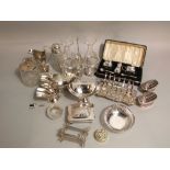 A good collection of silver plate to include a lancet toast rack, a twin decanter and stopper set, a