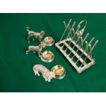 A collection of novelty silver plated items, to include three table salts in the form of dogs next