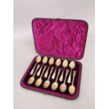 Cased set of twelve Victorian silver gilt berry spoons, maker CB, London, 1883, each 13cm long, 7.