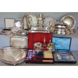 Two boxes containing a variety of silver plated items to include entree dishes, cocktail shaker,