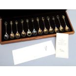 THE RSPB SILVER SPOON COLLECTION COMPRISING 12 SILVER SPOONS, EACH FINIAL WITH A GILT OVAL PANEL