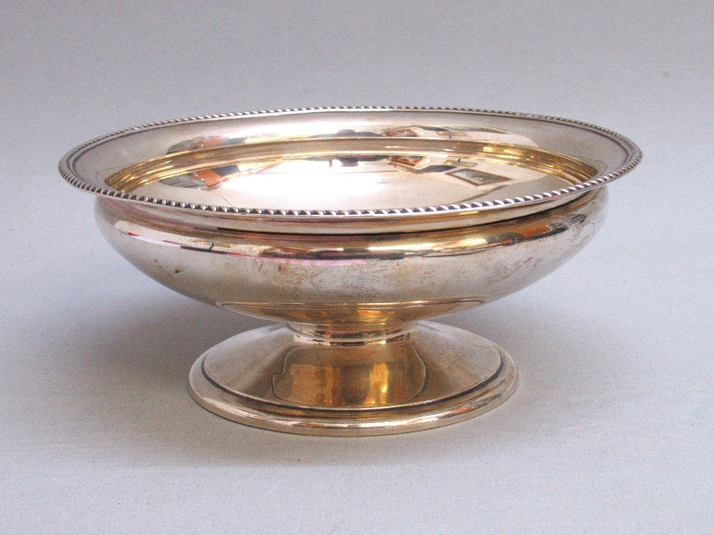 CIRCULAR SILVER BOWL WITH A GADROONED BORDER, ON A PEDESTAL FOOT BY JAMES DIXON & SON, SHEFFIELD