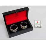 TWO OMANI WHITE METAL BANGLE NAPKIN RINGS IN A FITTED CASE, BY JAWAHIR, OMAN (114.5g)