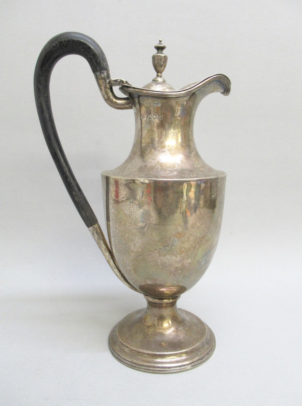 VICTORIAN SILVER CLARET JUG, THE DOMED COVER WITH URN SHAPED FINIAL, WOODEN LOOP HANDLE, BY