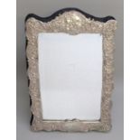 ELIZABETH II SILVER RECTANGULAR PHOTOGRAPH FRAME CAST WITH SCROLL AND FOLIATE DECORATION AND A