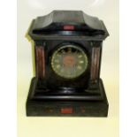LATE VICTORIAN MANTEL CLOCK WITH A CIRCULAR DIAL ENCLOSING AN EIGHT DAY STRIKING MOVEMENT, IN A
