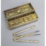 EDWARDIAN SILVER GILT CASED CURLING TONGS SET WITH SILVER GILT HANDLED TONGS, INTEGRAL REST AND