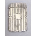 VICTORIAN SILVER ENGRAVED CARD CASE OF RECTANGULAR FORM WITH CENTRAL SHIELD CARTOUCHE TO THE FRONT