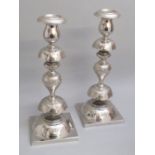 PAIR OF EARLY C20th ELECTROPLATE SHABBAT CANDLESTICKS BY NORBLIN & Co. , WALSAW, EACH STAMPED