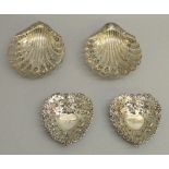PAIR OF VICTORIAN PIERCED SILVER SCALLOP SHAPED DISHES WITH SCROLL AND FOLIATE DECORATION, EACH ON